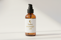 100ml amber glass bottle with white label and gold letters baby massage oil black lid pump top